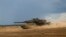 Бойовий танк Leopard 2A6 німецької армії бере участь у литовсько-німецьких військових навчаннях на полігоні в Пабраде, на північ від столиці Литви Вільнюса, 26 червня 2023 р. AP Photo/Mindaugas Kulbis