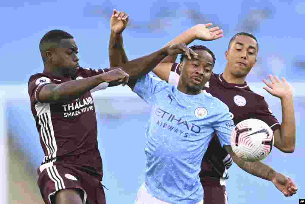 Leicester&#39;s Nampalys Mendy, left vies for the ball with Manchester City&#39;s Raheem Sterling, center and Leicester&#39;s Youri Tielemans during the English Premier League soccer match between Manchester City and Leicester City at the Etihad stadium in Manchester, England.