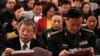 Delegates read the work reports which is delivered by Chinese Premier Li Keqiang at the opening session of the annual National People's Congress at the Great Hall of the People in Beijing, Tuesday, March 5, 2019. 