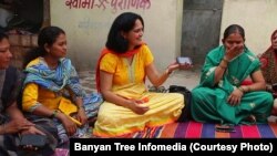 Indian physician Aparna Hegde meets with villagers in Solapur, Maharashtra state, to explain how mobile technology can improve health care. 