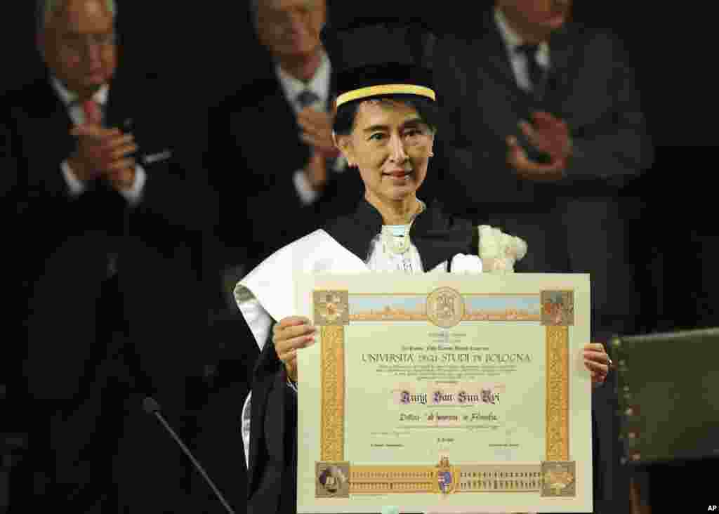 Aung San Suu Kyi, Burma's Nobel Peace Prize laureate and former long-time political prisoner, poses with her honorary degree in Philosophy from the University of Bologna, central Italy.