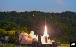 In this photo provided by South Korea Defense Ministry, a Hyunmoo II ballistic missile is fired during an exercise at an undisclosed location in South Korea, Sept. 4, 2017. South Korea's military said it conducted a live-fire exercise simulating an attack on North Korea's nuclear test site to "strongly warn" Pyongyang over the latest nuclear test.