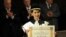 Aung San Suu Kyi, Burma's Nobel Peace Prize laureate and former long-time political prisoner, poses with her honorary degree in Philosophy from the University of Bologna, central Italy.