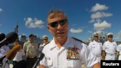 FILE - U.S. Navy Admiral Harry Harris Jr. addresses the media during a news conference kicking off the RIMPAC exercise at Joint Base Pearl Harbor Hickam in Honolulu, Hawaii, June 30, 2014. 