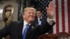 U.S. President Donald Trump waves as he arrives to deliver his first State of the Union address to a joint session of Congress inside the House Chamber on Capitol Hill in Washington, U.S.