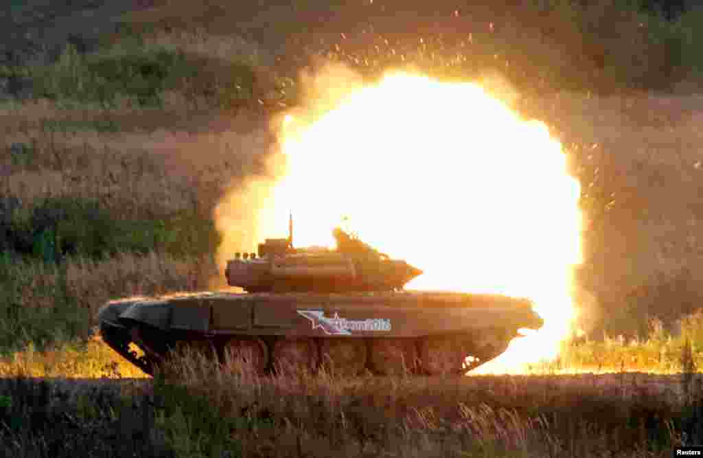 A Russian battle tank fires during a demonstration at the international military-technical forum &quot;ARMY-2016&quot; in Moscow region.