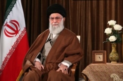 FILE - In this picture released by the official website of the office of the Iranian supreme leader, Supreme Leader Ayatollah Ali Khamenei sits prior to address nation on state television, in Tehran, March 22, 2020.