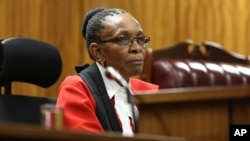 Presiding Judge Thokozile Masipa listens to arguments at the end of the fourth day of sentencing proceedings for Oscar Pistroius in the high court in Pretoria, South Africa, Oct. 16, 2014.