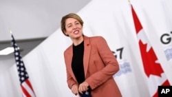 Canada's Minister of Foreign Affairs Melanie Joly arrives for a G-7 Foreign and Development Ministers Session with guest countries and ASEAN nations in Liverpool, England, Dec. 12, 2021.