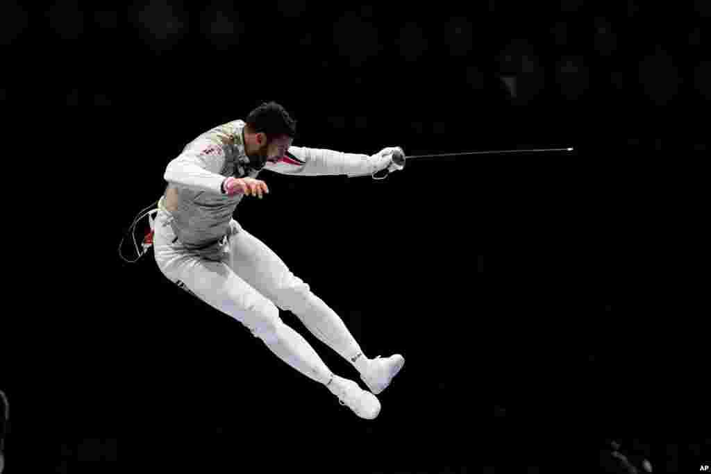 Alaaeldin Abouelkassem of Egypt celebrates after winning a men's individual round of 16 Foil competition at the 2020 Summer Olympics in Chiba, Japan.