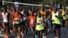 Keenyaan maratoonii Singapoor dhiiraa fi dhalaalleen mootee addunyaan afaan qabsiifte