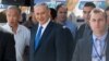 Israeli Prime Minister and Likud party's candidate running for general elections, Benjamin Netanyahu is surrounded by bodyguards during his visit in Har Homa, an Israeli settlement neighbourhood of annexed east Jerusalem, March 16, 2015