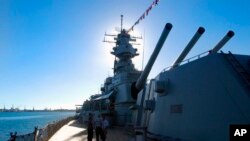 FILE - This Nov. 11, 2004, file photo shows The USS Missouri's main battery of three 16-inch/.05 caliber gun turrets in Pearl Harbor, Hawaii. 