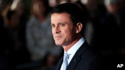 Outgoing Prime Minister Manuel Valls, who stepped down Tuesday to run for president, looks on after the hand-over ceremony in Paris, Dec.6, 2016. 