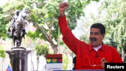 Venezuela's President Nicolas Maduro gestures while he speaks during his weekly broadcast "Los Domingos con Maduro" (The Sundays with Maduro) in Caracas, Venezuela, July 23, 2017.