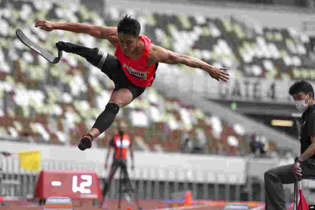 Japanese Junta Kosuda competes in the men&#39;s long jump during an athletics test event for the Tokyo 2020 Paralympics Games at National Stadium in Tokyo, Japan.