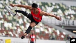 Japanese Junta Kosuda competes in the men's long jump during an athletics test event for the Tokyo 2020 Paralympics Games at National Stadium in Tokyo, Tuesday, May 11, 2021. 