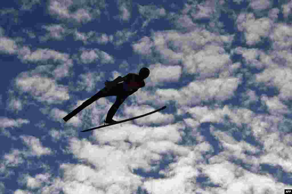 Ziga Jelar of Slovenia soars through the air during the men&#39;s HS130 ski jumping team event at the FIS Nordic World Ski Championships in Innsbruck, Austria.