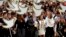 Colombia's President Juan Manuel Santos carries to Congress the peace deal with rebels of the Revolutionary Armed Forces of Colombia, FARC, in Bogota, Aug. 25, 2016.