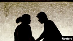 A couple in Athens' Syntagma Square