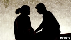 A couple in Athens' Syntagma Square