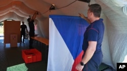 Firefighters set up an improvised polling station in Siroka Niva, Czech Republic, on Sept. 20, 2024. The nation's northeast region suffered massive flooding this week, and many schools and other buildings that serve as polling stations were submerged and damaged.