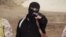 FILE - An Islamic State militant holdsa gun in this still image from an undated video made available on a social media website on April 19, 2015. 