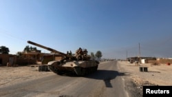 A tank of Iraqi security forces is seen in the town 