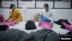 Women work in a garment factory in Faisalabad, located in Pakistan's Punjab province August 23, 2011. Pakistan's textile industry accounts for 38 percent of workers in the manufacturing sector and over half of its exports, which stood at nearly $25 billio