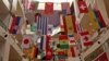 Flags of countries participating in Qatar World Cup 2022, are seen at a shopping mall in Mumbai