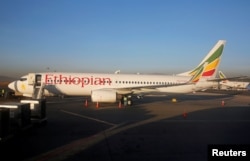 FILE - Workers service an Ethiopian Airlines Boeing 737-800 plane at the Bole International Airport in Ethiopia's capital Addis Ababa, Jan. 26, 2017.