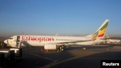 FILE - Workers service an Ethiopian Airlines Boeing 737-800 plane at the Bole International Airport in Ethiopia's capital Addis Ababa, Jan. 26, 2017.