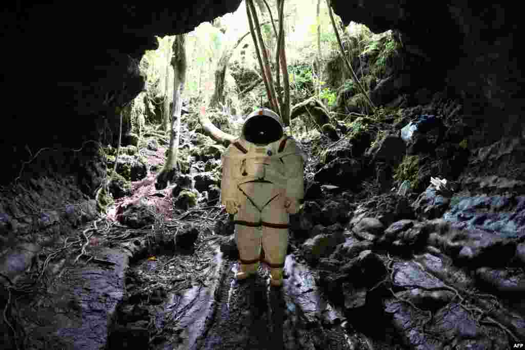 Peter Weiss, director of the Space Department of COMEX, tests a pressurized suit identical to those used in space expeditions in the lava tunnel of &quot;Caverne Gendarme&quot; in Saint-Philippe, the French overseas island of Reunion.