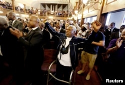 Rev. Sandy Drayton, reacts during a prayer vigil held at Morris Brown AME Church in Charleston, South Carolina, June 18, 2015.