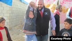 Mohamed Khairullah visits Atmah Refugee camp in 2014 (Photo: Courtesy Mohamed Khairullah)