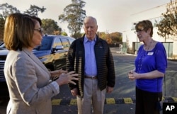 House Minority Leader Nancy Pelosi, D-Calif., left, gestures while speaking beside Rep. Mike Thompson, D-Calif., and Naomi Fuchs, right, CEO of Santa Rosa Community Health, during a tour of the wildfire-affected Vista campus in Santa Rosa, Calif., Oct. 28, 2017.