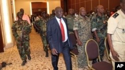Michel Djotodia, center, rebel leader who declared himself president, arrives for meetings with government armed forces, Bangui, Central African Republic, March 28, 2013.