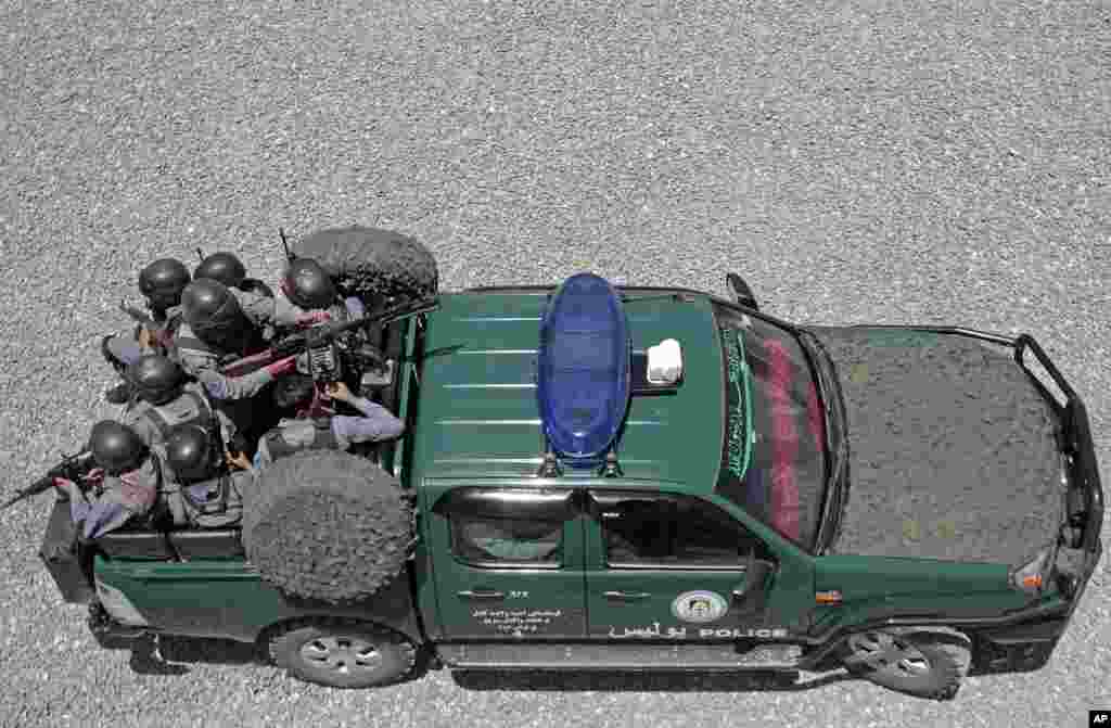 Afghan police and soldiers guard checkpoints at almost every intersection, searching vehicles and frisking drivers in a massive security operation ahead of elections,&nbsp;Kabul, June 13, 2014.&nbsp;