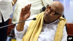 Leader of the Dravida Munnetra Kazhagam party M. Karunanidhi speaks at a press conference withdrawing support to India’s ruling United Progressive Alliance government, at the party office in Chennai, India, March 19, 2013.
