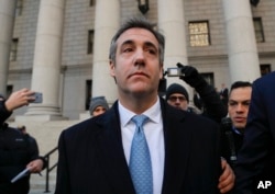 FILE - Michael Cohen walks out of federal court Nov. 29, 2018, in New York, after pleading guilty to lying to Congress about work he did on an aborted project to build a Trump Tower in Russia.