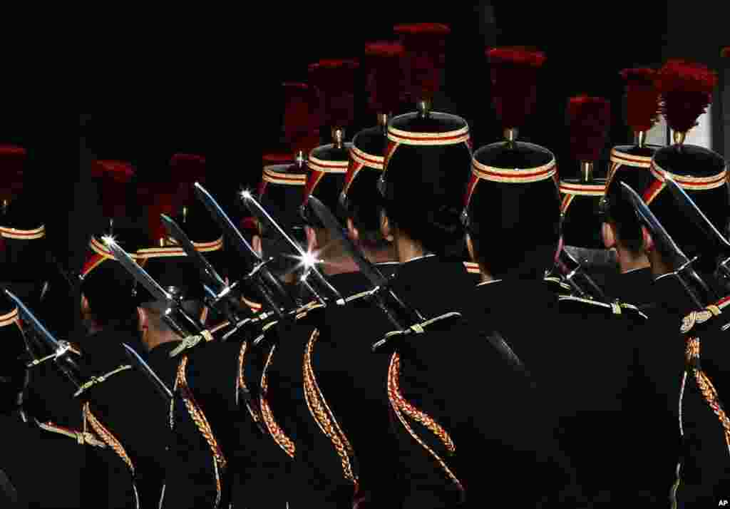 French Republican Guards leave after a meeting between President of Comoros Azali Assoumani and French President Francois Hollande at the Elysee Palace in Paris.