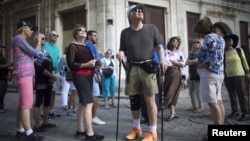 American tourists look around during a tour of old Havana, Cuba, Dec. 14, 2015.