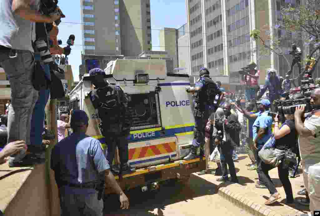 A heavily guarded vehicle carries Oscar Pistorius to prison, Pretoria, South Africa, Oct. 21, 2014.