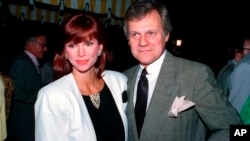FILE - This June 13, 1986 file photo shows actress Victoria Principal and actor Ken Kercheval, co-stars of the popular TV-show "Dallas." Kercheval, who played Cliff Barnes on the hit TV series “Dallas” has died at age 83. 
