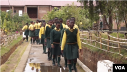 FILE - Students are seen at a girls school in Malawi. The government aims to vaccine 1.5 million girls between the ages of 9 and 14 against the human papilloma virus (HPV), which can cause cervical cancer.