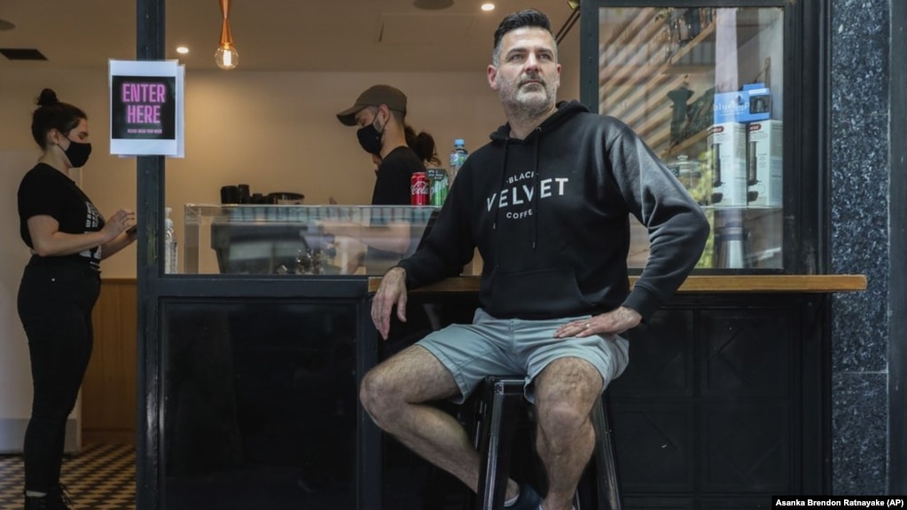 Director and founder of Black Velvet coffee shop Darren Silverman poses for a photo outside his cafe in Melbourne, Australia, Wednesday, Oct. 28, 2020. (AP Photo/Asanka Brendon Ratnayake)