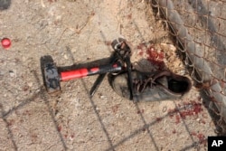 Image released by the Spanish Guardia Civil on Aug. 22, 2018 shows items used by alleged migrants after they stormed a fence to enter the Spanish enclave of Ceuta, Spain.