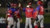 En esta imagen de junio de 2021 miembros del equipo Cuba de béisbol celabran una victoria ente Colmbia en torneo celebrado en Palm Beach, Florida, EE. UU.