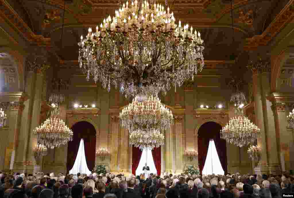 Belgium&#39;s King Philippe (back C) delivers a speech during a traditional new year reception for international institutions&#39; representatives, government members and business leaders at the Brussels Royal Palace.