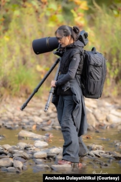 Anchalee Dulayathitikul carries a backpack and camera as a photographer during her weekend trip in MD.